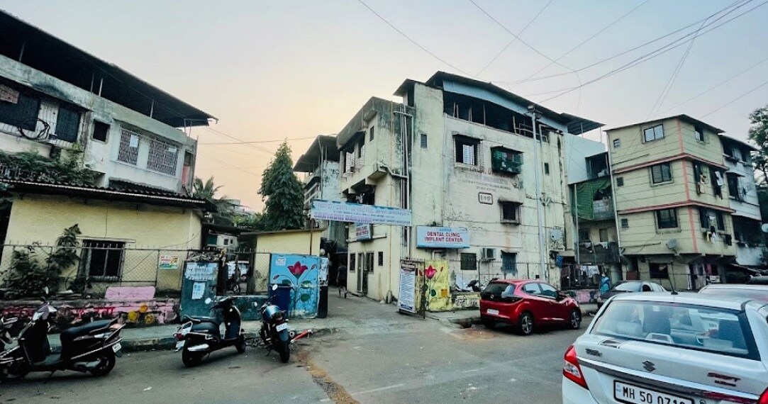Nerul Sector 8_a city street filled with lots of parked cars